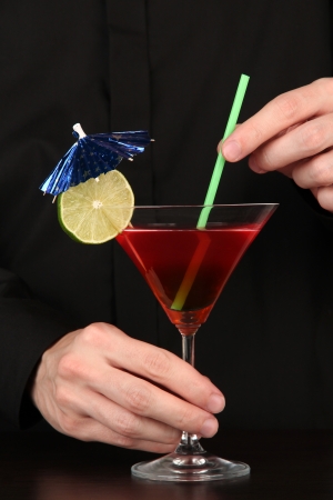 Bartender making and decorating cocktail on close-upの写真素材