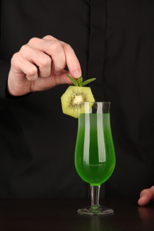 Bartender making and decorating cocktail on close-upの写真素材