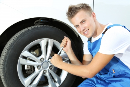 Auto mechanic changing wheelの写真素材