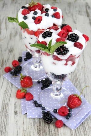 Natural yogurt with fresh berries on wooden backgroundの写真素材