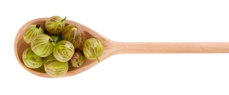Gooseberry in wooden spoon isolated on white の写真素材