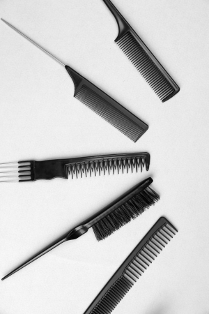 Black combs on gray backgroundの写真素材