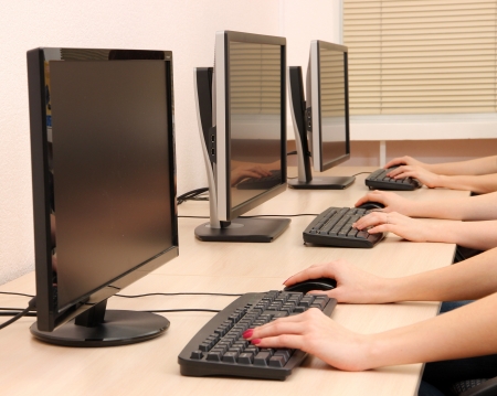 Female hands typing on keyboardの写真素材