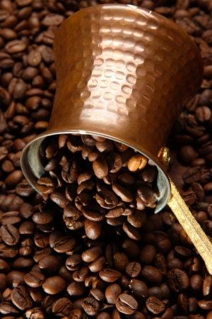 Metal turk on coffee beans backgroundの写真素材