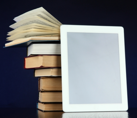 Tablet and books on bright backgroundの写真素材
