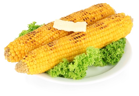 Delicious golden grilled corn with butter isolated on whiteの写真素材