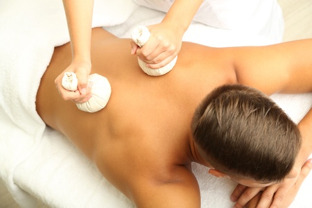 Young man having back massage close upの写真素材