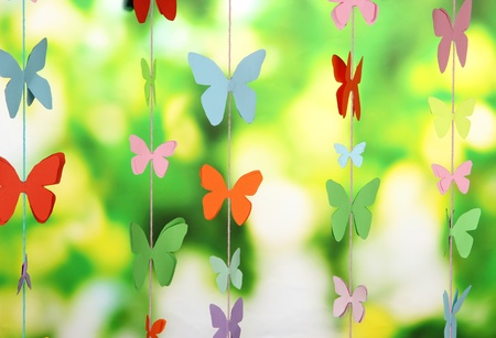 Handmade paper garland on bright backgroundの写真素材