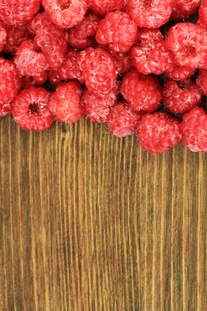 Fresh raspberry on wooden backgroundの写真素材