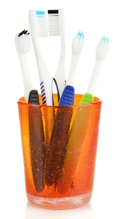 Tooth-brushes in glass isolated on whiteの写真素材