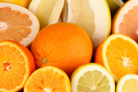 Lots ripe citrus close-up backgroundの写真素材