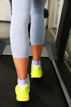 Women legs on treadmill in gumの写真素材