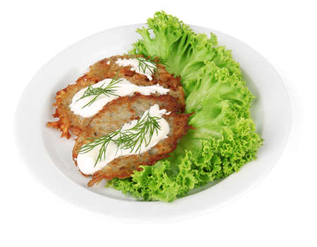 Potato pancakes on plate, isolated on whiteの写真素材