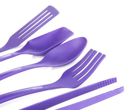 Plastic kitchen utensils isolated on whiteの写真素材