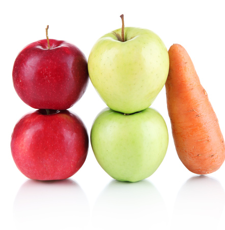 Sweet apples and carrot isolated on whiteの写真素材