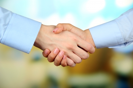 Business handshake on bright backgroundの写真素材
