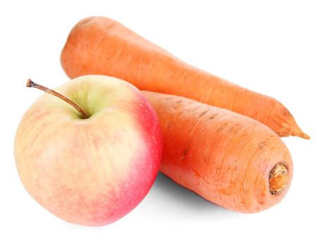 Sweet apple and carrots isolated on whiteの写真素材