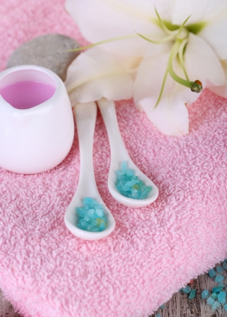 Beautiful spa setting with lily on wooden table close-upの写真素材
