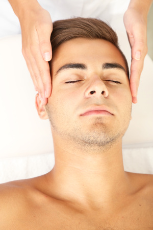 Man having head massage close upの写真素材