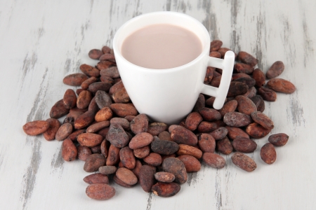 Cocoa drink and cocoa beans on wooden backgroundの写真素材