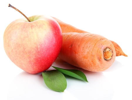 Sweet apple and carrots isolated on whiteの写真素材