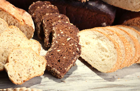 Much bread on wooden board
