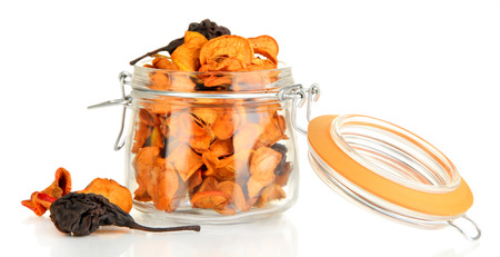 Assorted dried fruits in bank isolated on whiteの写真素材