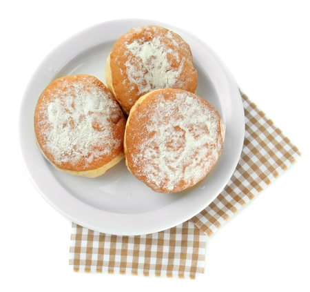 Tasty donuts on plate, isolated on whiteの写真素材