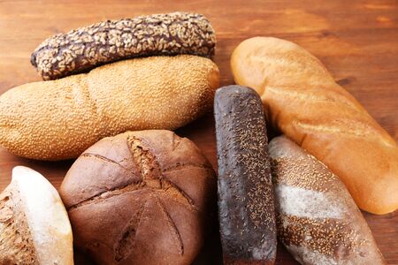 Much bread on wooden board