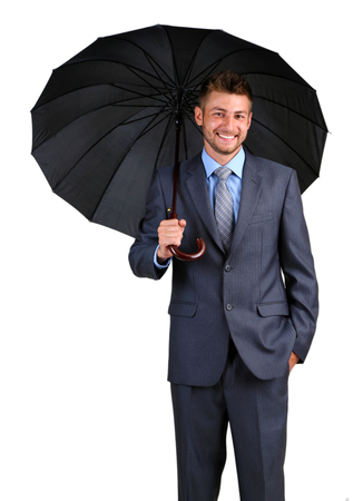 Businessman with umbrella. on gray backgroundの写真素材