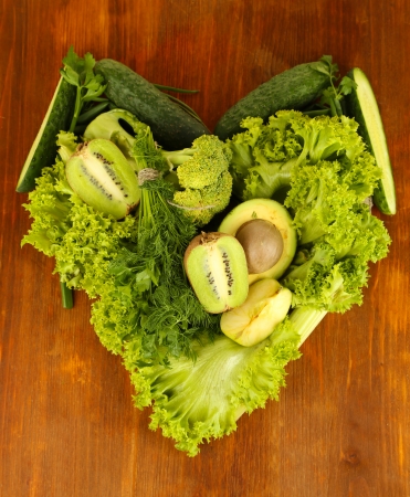 Fresh green vegetables and fruits, on wooden の写真素材