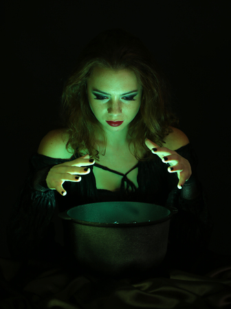 Halloween witch on black backgroundの写真素材