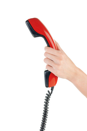 Receiver in female hand, isolated on whiteの写真素材