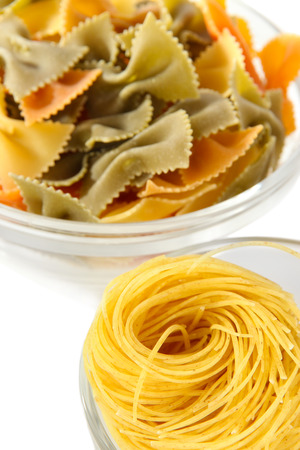 Different types of pasta isolated on whiteの写真素材