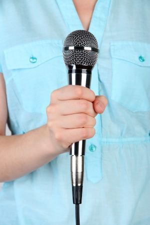 Female with microphone close-up backgroundの写真素材