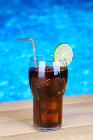 Tasty cocktail on swimming pool backgroundの写真素材
