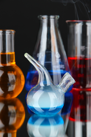 Laboratory glassware on black の写真素材
