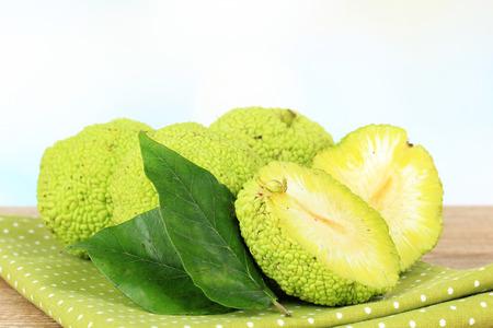 Osage Orange fruits (Maclura pomifera), on wooden table