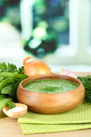 Tasty spinach soup, on wooden tableの写真素材