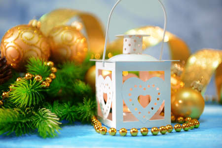 Christmas lantern, fir tree and decorations  on light backgroundの写真素材