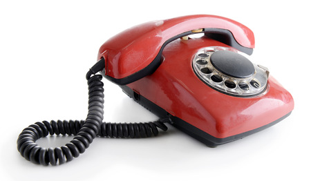 Red retro telephone, isolated on whiteの写真素材