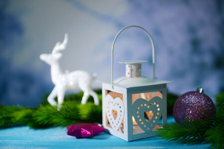 Christmas lantern, fir tree and decorations  on light backgroundの写真素材