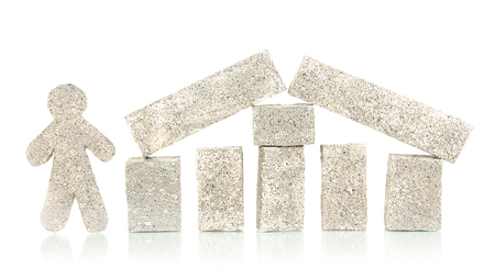Building blocks with little man isolated on whiteの写真素材