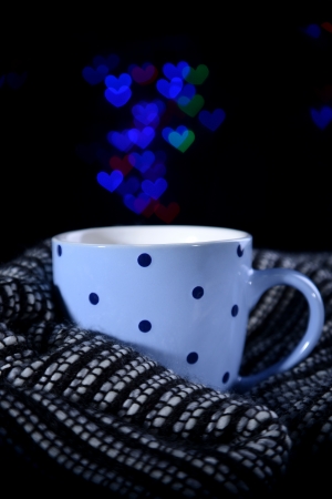 Cup of coffee with plaid on dark backgroundの写真素材