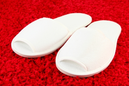 White slippers on carpet backgroundの写真素材