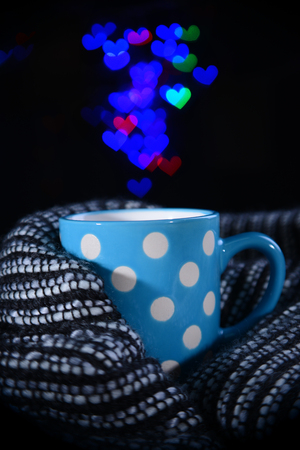 Cup of coffee with plaid on dark backgroundの写真素材