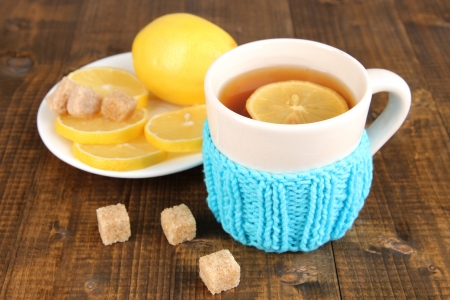 Cup of tea with lemon on wooden tableの写真素材