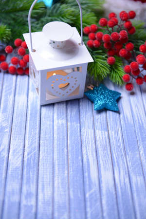 Christmas lantern, fir tree and decorations  on light backgroundの写真素材