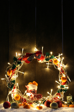 Beautiful Christmas wreath, on wooden backgroundの写真素材
