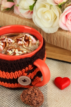 Cup with knitted thing on it close upの写真素材